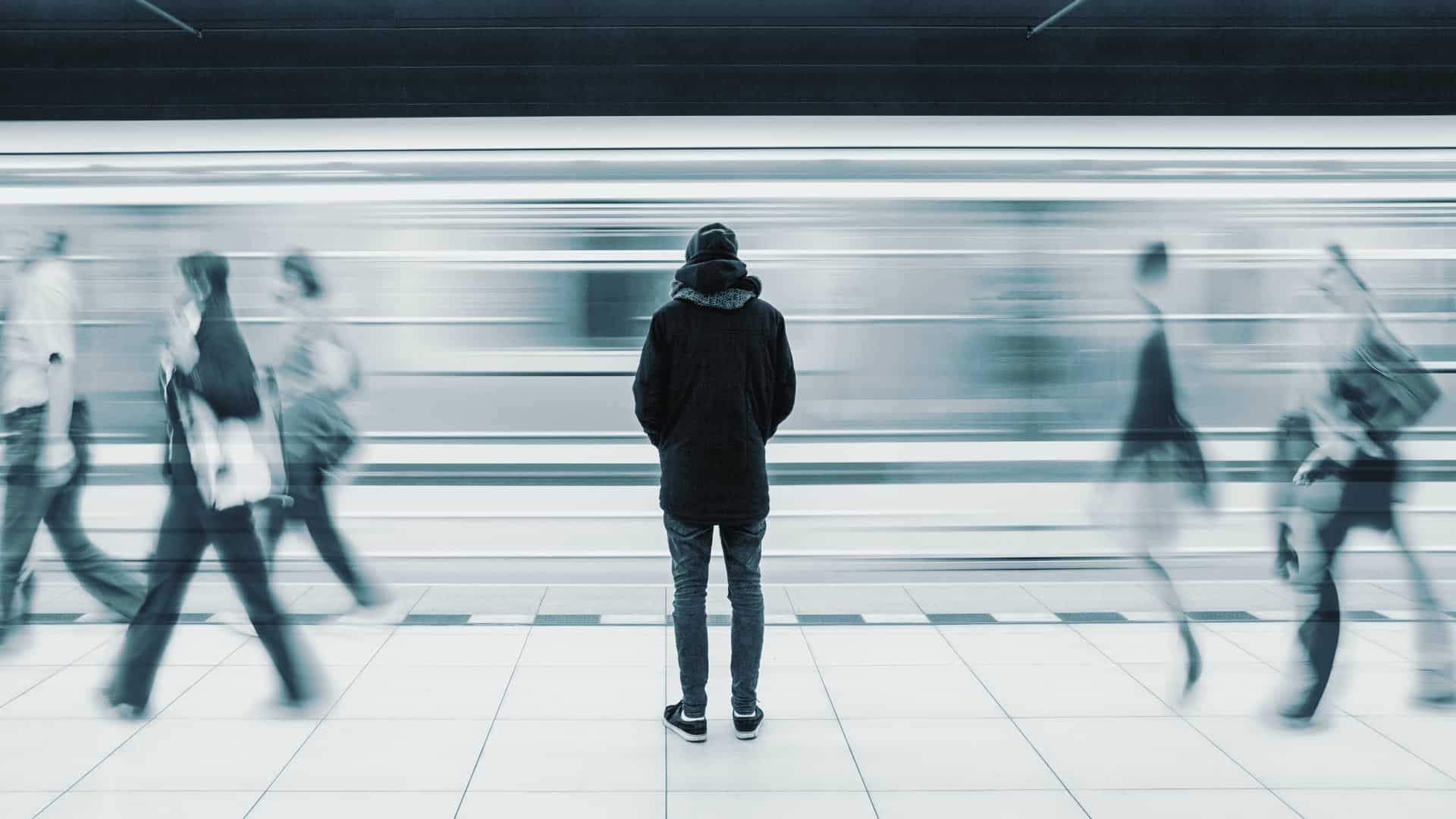 man at busy subway station